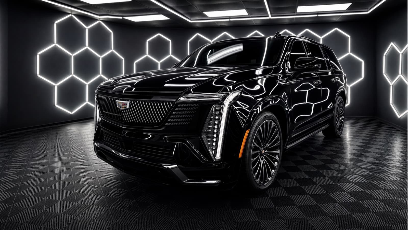 Blacked-out Cadillac Escalade under the studio hexagon lights